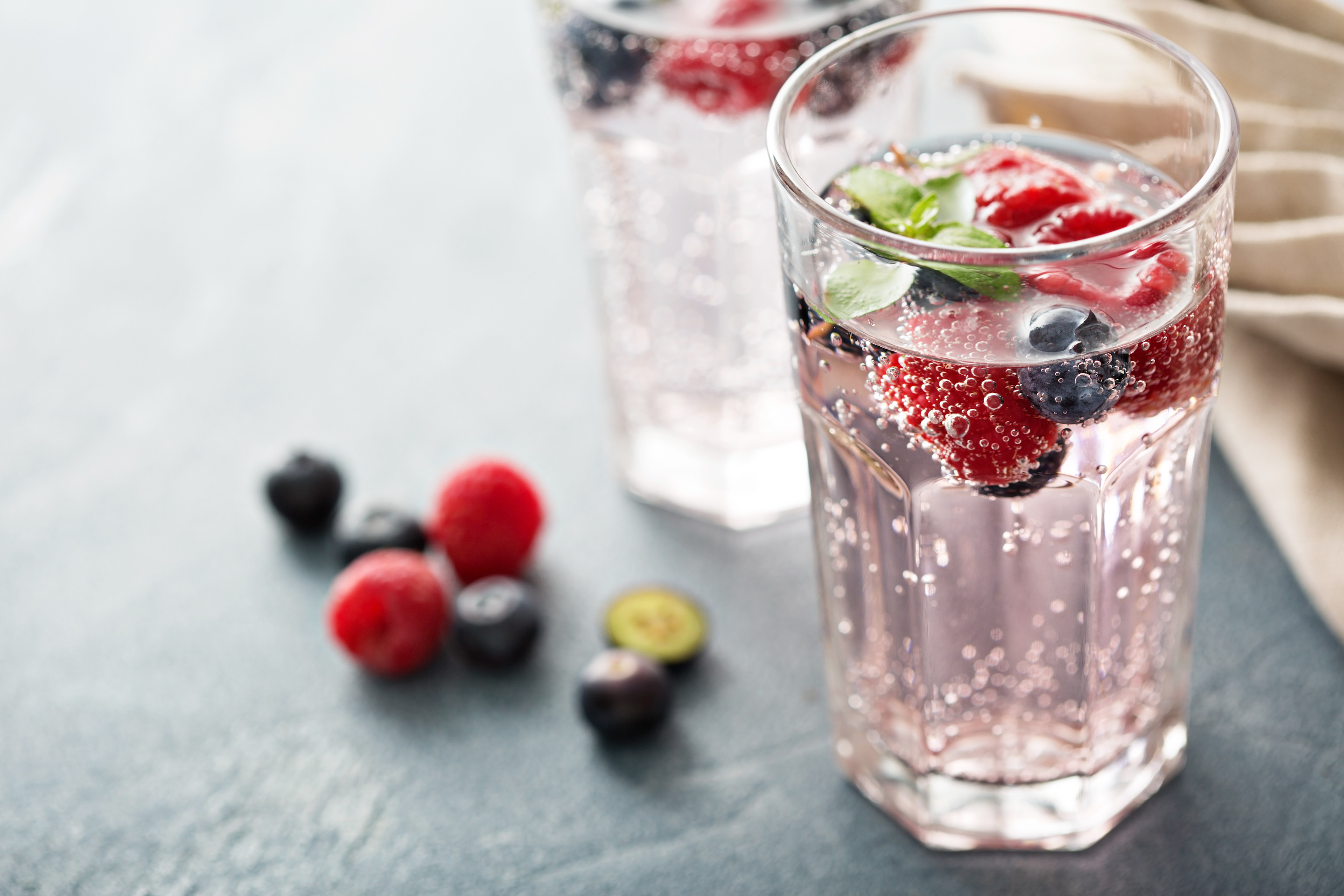 Sparkling water with raspberries and blueberries Renu Dental Blog